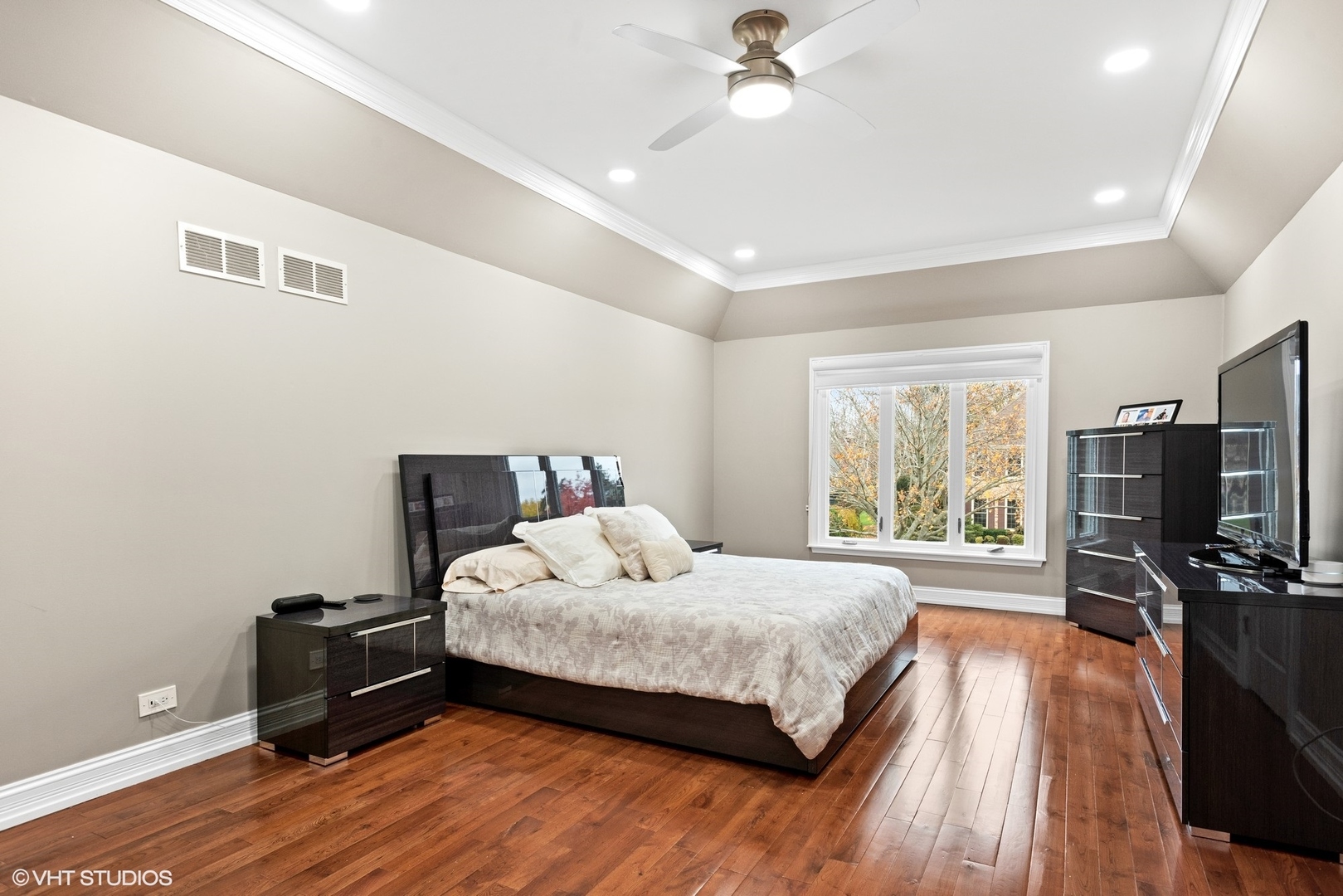 601 Partridge Drive West Chicago, IL 60185 - Photo 25 of 39 a bedroom with a bed and a flat tv screen on dresser