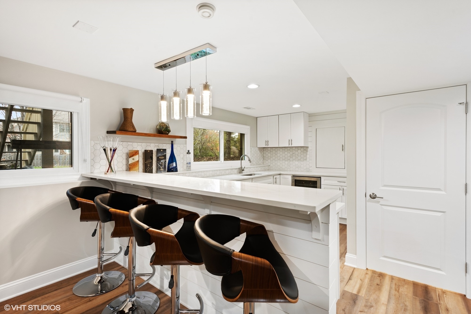 601 Partridge Drive West Chicago, IL 60185 - Photo 33 of 39 a kitchen with a stove a refrigerator and a dining table