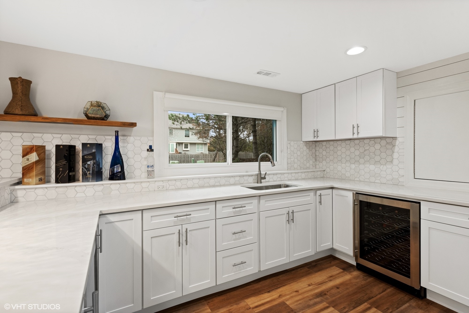 601 Partridge Drive West Chicago, IL 60185 - Photo 34 of 39 a kitchen with white cabinets and sink