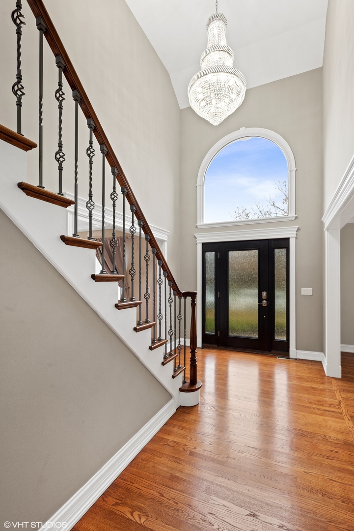 601 Partridge Drive West Chicago, IL 60185 - Photo 8 of 39 a view of entryway and hall with wooden floor