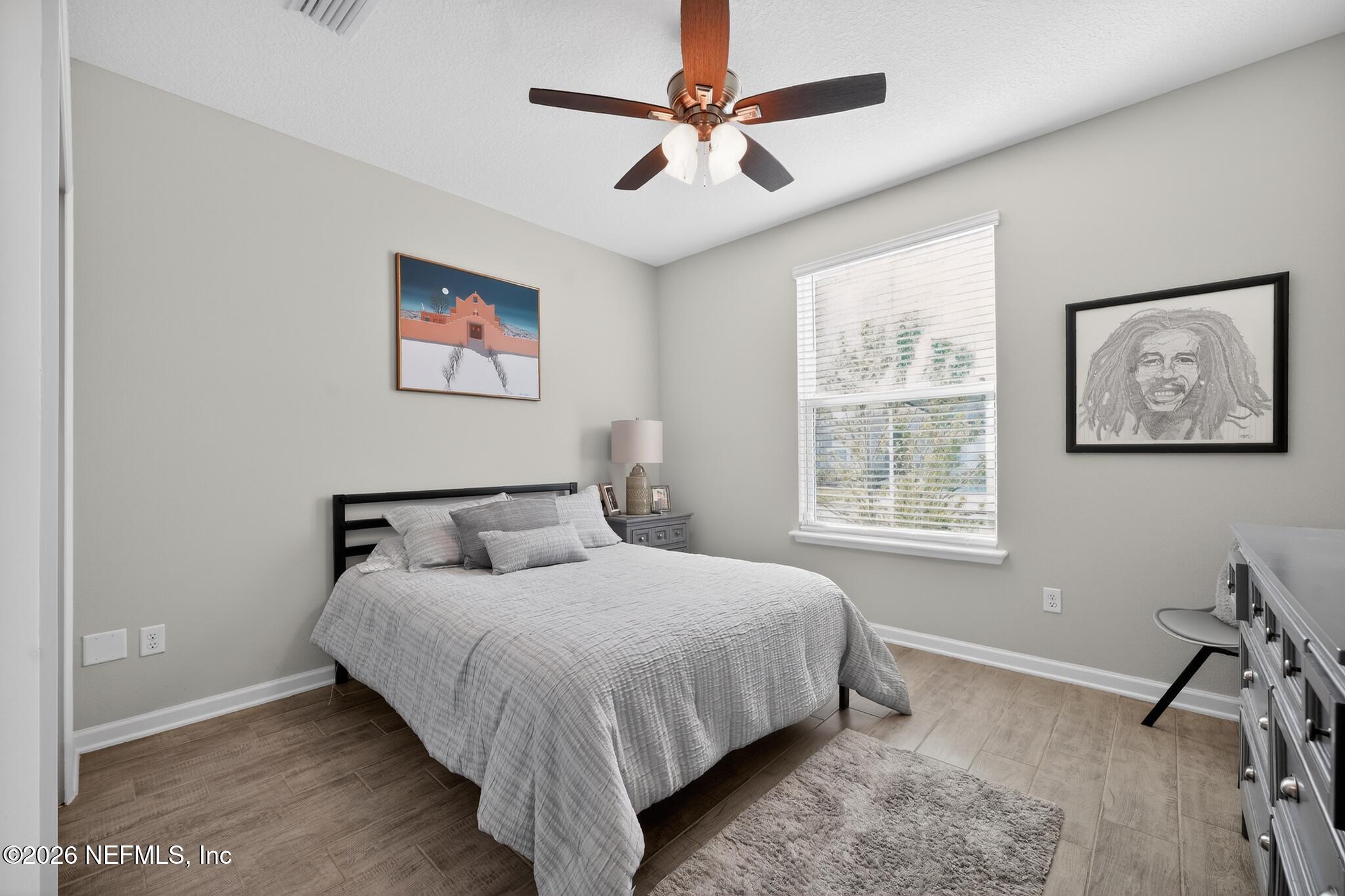 75505 Banyan Way Yulee, FL 32097 - Photo 17 of 30 a bedroom with a bed and a table