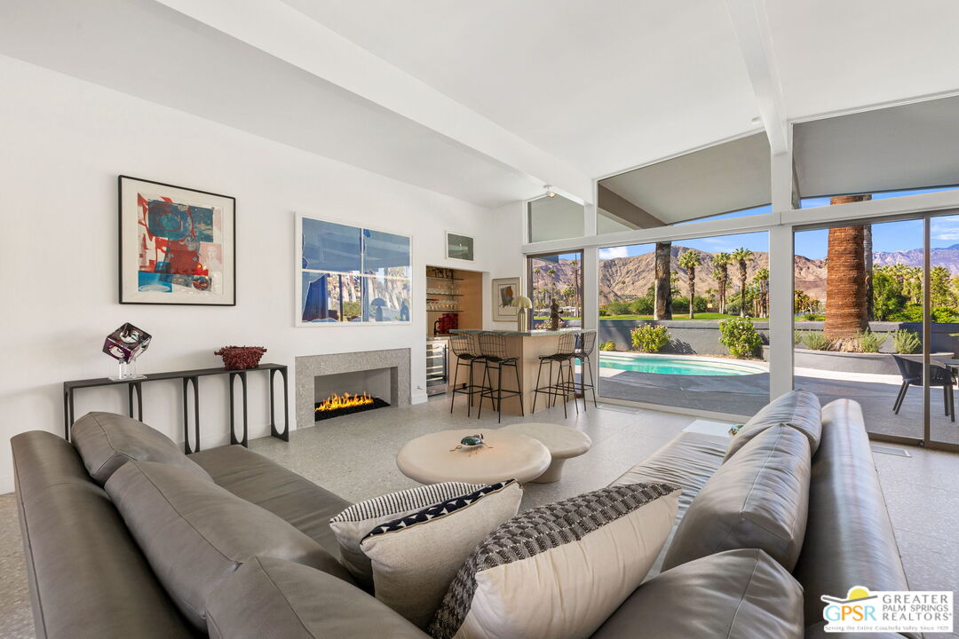 40181 Sand Dune Road Rancho Mirage, CA 92270 - Photo 15 of 75 a living room with furniture and a large window