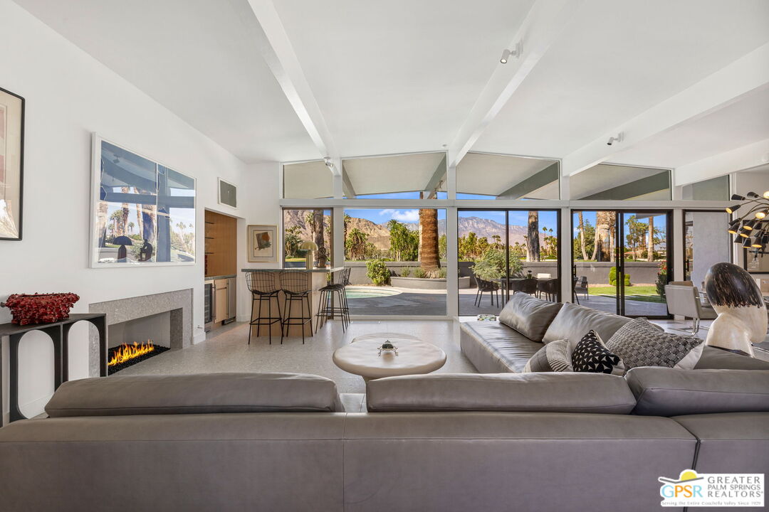 40181 Sand Dune Road Rancho Mirage, CA 92270 - Photo 16 of 75 a living room with furniture and a large window