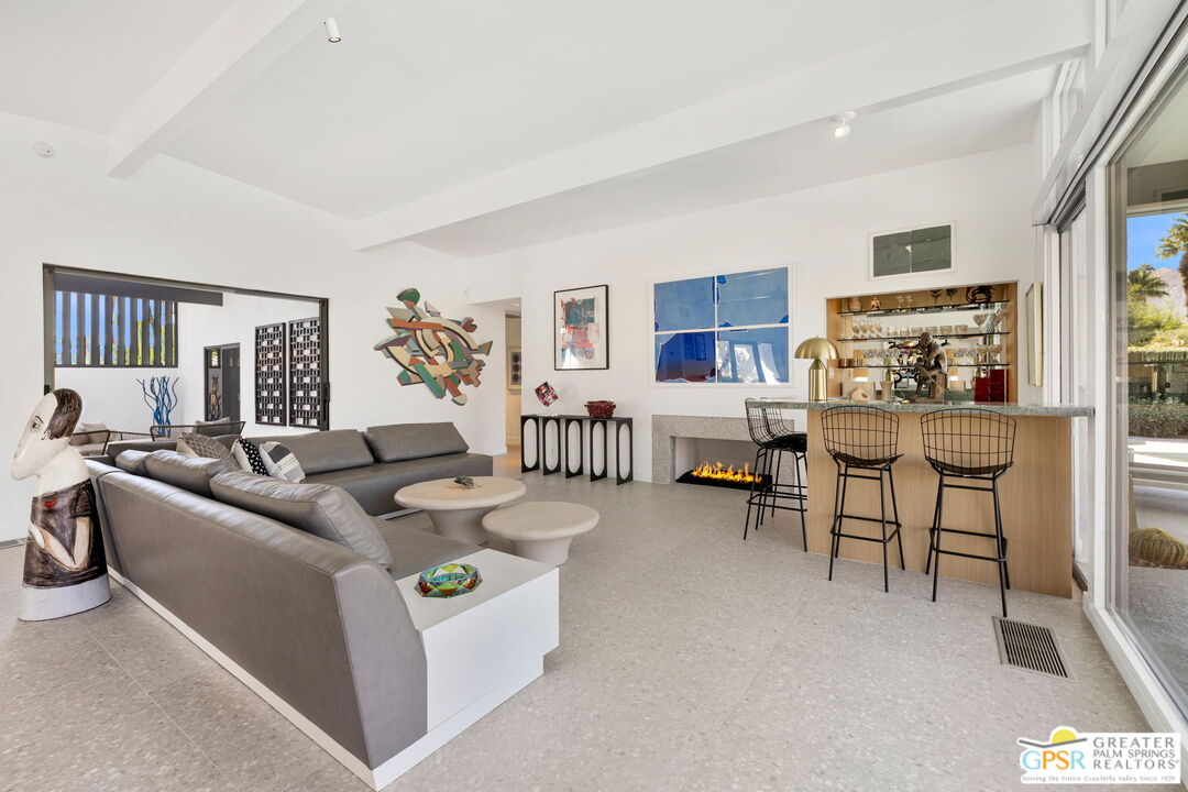 40181 Sand Dune Road Rancho Mirage, CA 92270 - Photo 17 of 75 a living room with furniture and a large window