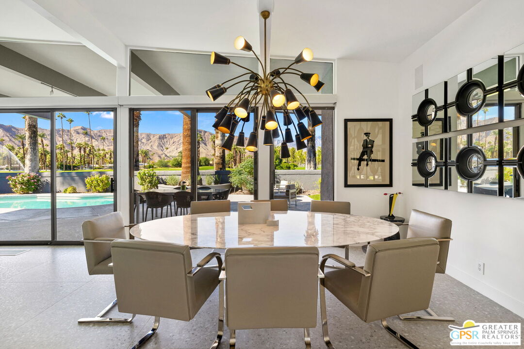 40181 Sand Dune Road Rancho Mirage, CA 92270 - Photo 19 of 75 a view of a dining room with furniture window and outside view