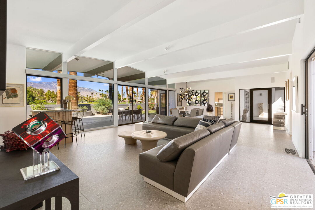 40181 Sand Dune Road Rancho Mirage, CA 92270 - Photo 21 of 75 a living room with furniture and a large window