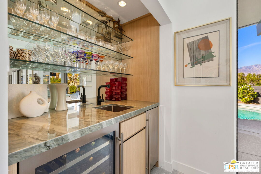 40181 Sand Dune Road Rancho Mirage, CA 92270 - Photo 23 of 75 a kitchen with stainless steel appliances granite countertop a sink and a counter top space