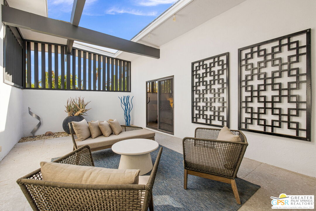 40181 Sand Dune Road Rancho Mirage, CA 92270 - Photo 25 of 75 a living room with furniture and a rug