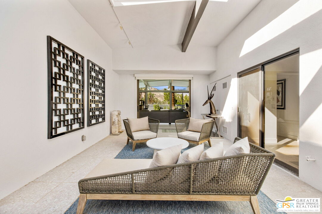40181 Sand Dune Road Rancho Mirage, CA 92270 - Photo 27 of 75 a living room with furniture and a window