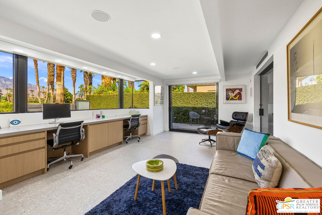 40181 Sand Dune Road Rancho Mirage, CA 92270 - Photo 37 of 75 a living room with furniture and a large window