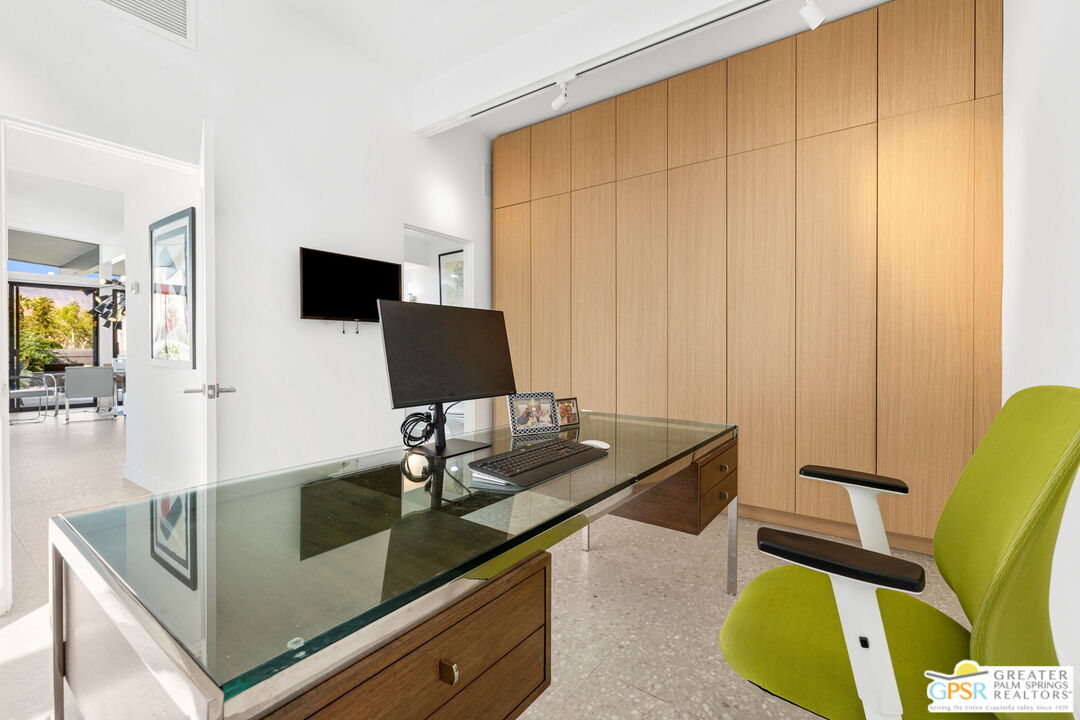 40181 Sand Dune Road Rancho Mirage, CA 92270 - Photo 55 of 75 a living room with furniture and a flat screen tv