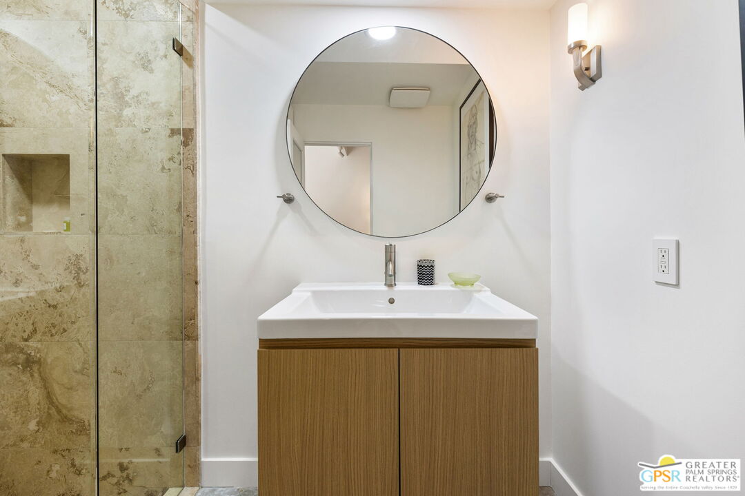 40181 Sand Dune Road Rancho Mirage, CA 92270 - Photo 57 of 75 a bathroom with a sink and a mirror