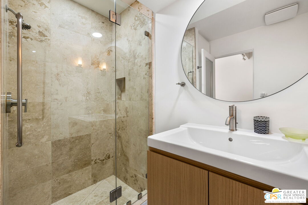 40181 Sand Dune Road Rancho Mirage, CA 92270 - Photo 58 of 75 a bathroom with a sink shower and a mirror