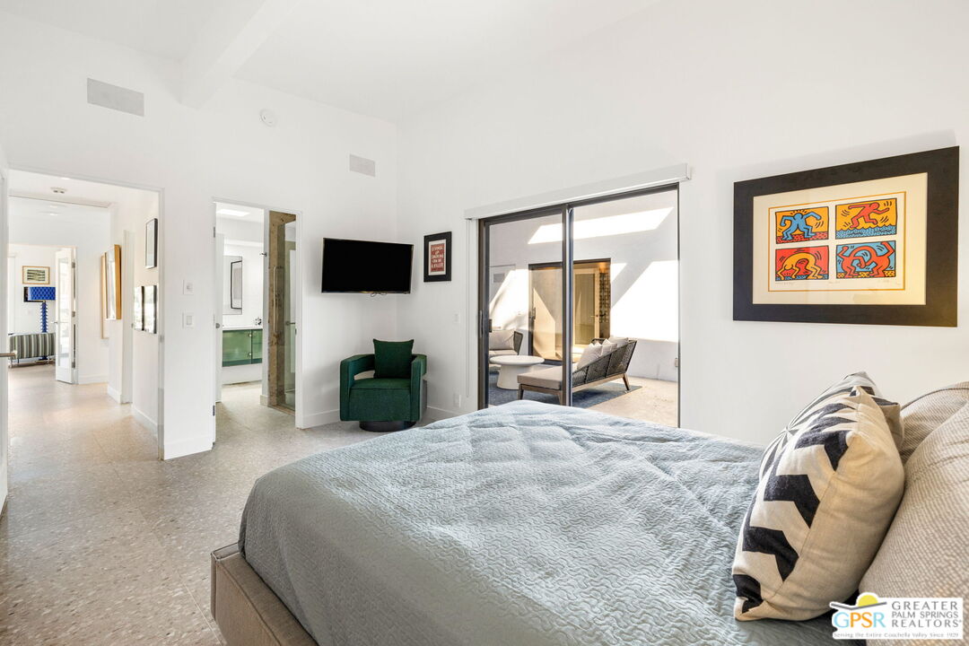 40181 Sand Dune Road Rancho Mirage, CA 92270 - Photo 60 of 75 a bed room with a bed and a television