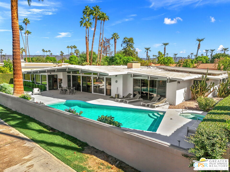 40181 Sand Dune Road Rancho Mirage, CA 92270 - Photo 62 of 75 a view of a house with swimming pool and porch with furniture