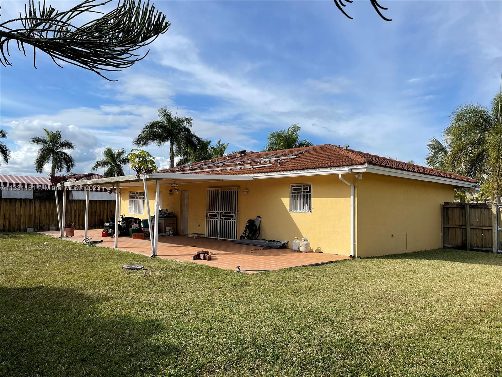 12472 Southwest 220th Street Miami, FL 33170 - Photo 2 of 10 a view of a backyard of the house