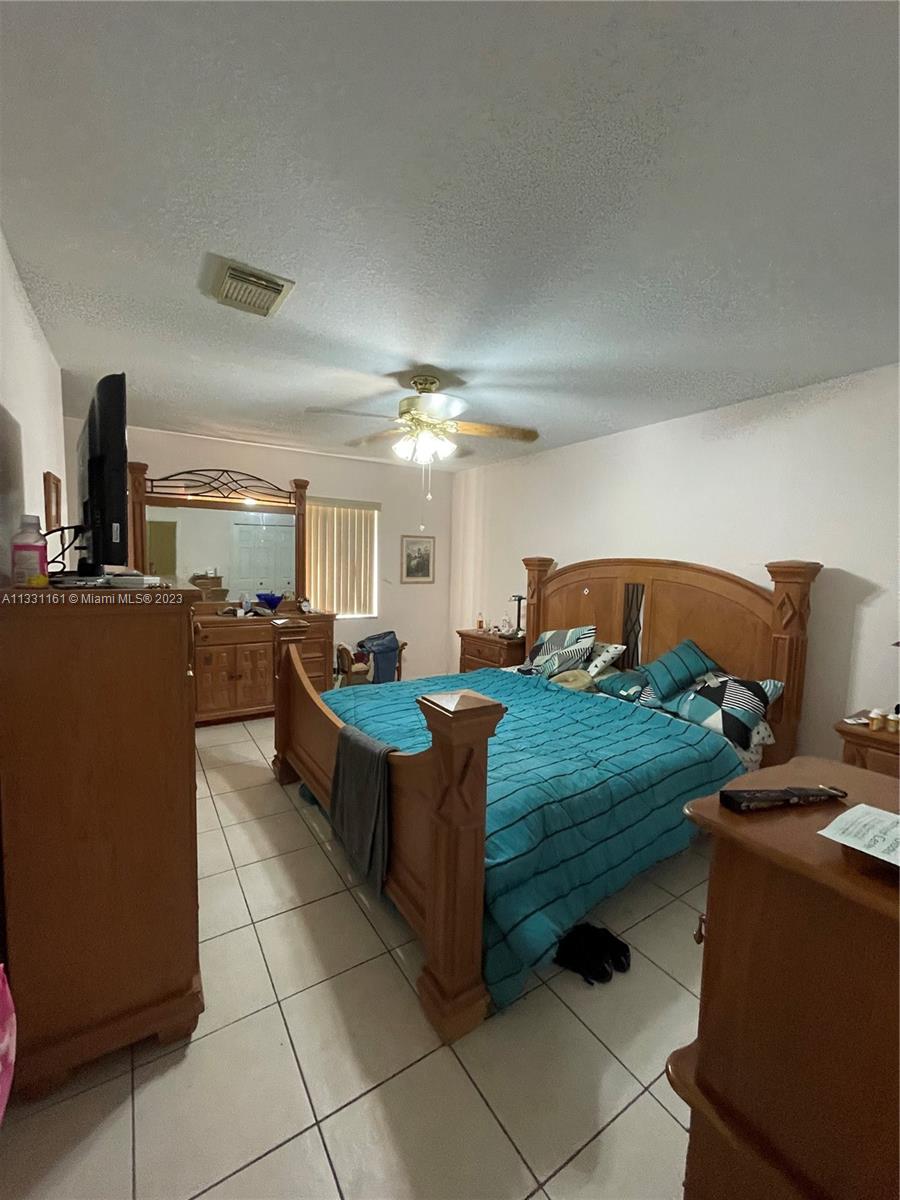 12472 Southwest 220th Street Miami, FL 33170 - Photo 8 of 10 a large room with lots of table and chairs