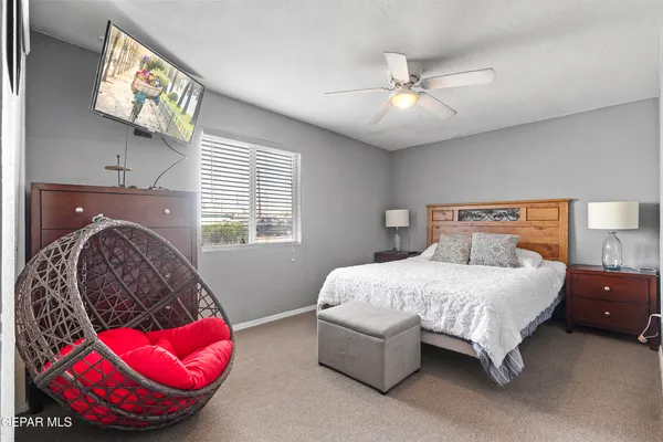 a bedroom with a bed and a couch