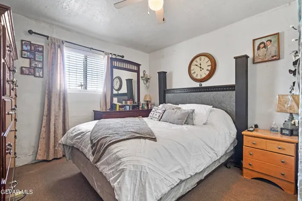 a bedroom with a bed and a closet