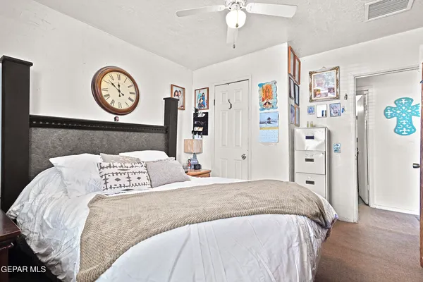 a bedroom with a bed and a table in it