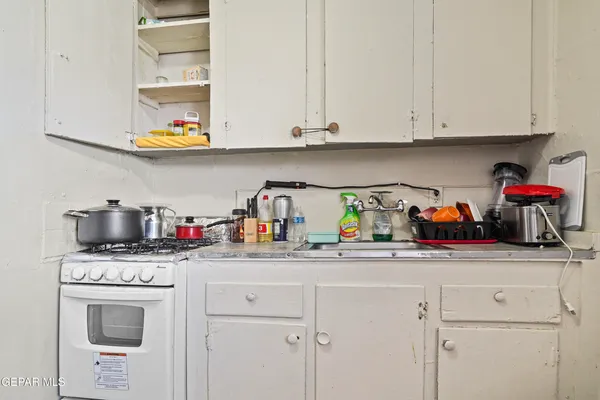 a kitchen with stainless steel appliances granite countertop a sink dishwasher and cabinets