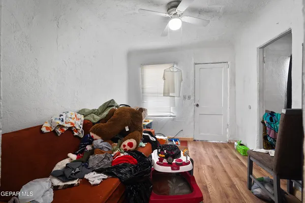 a living room with furniture and flowers