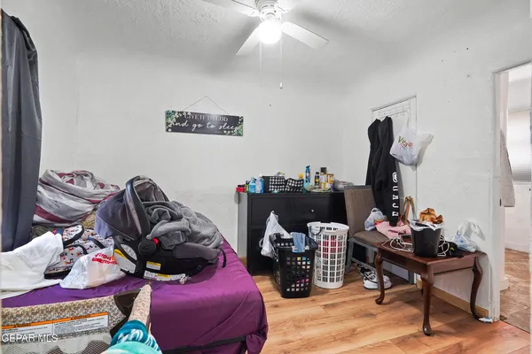 a living room with furniture and a mirror