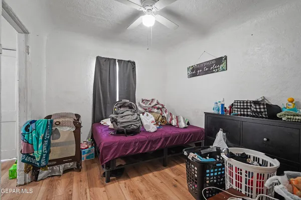 a bedroom with furniture and a window