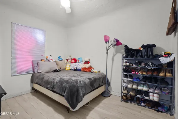 a bedroom with a bed and closet