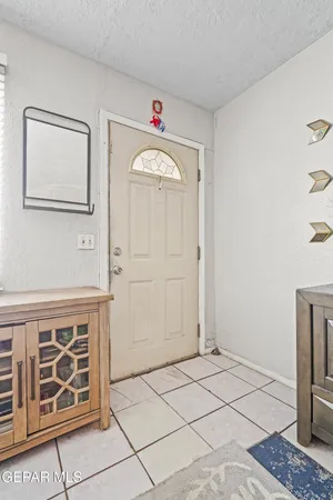 a view of a hallway with entryway door