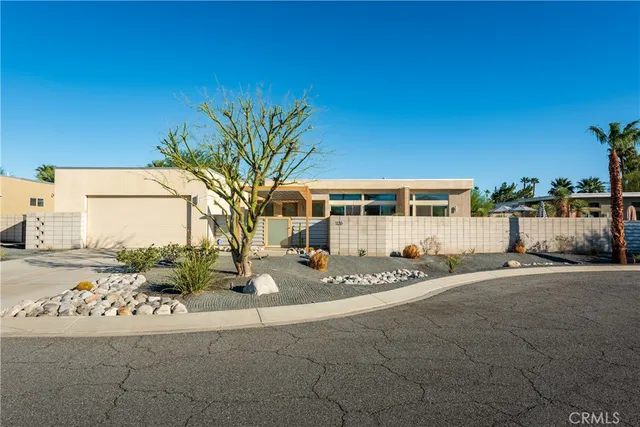 a view of a house with backyard porch and sitting area