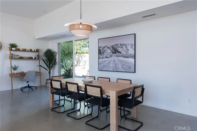 a view of a dining room with furniture window and outside view