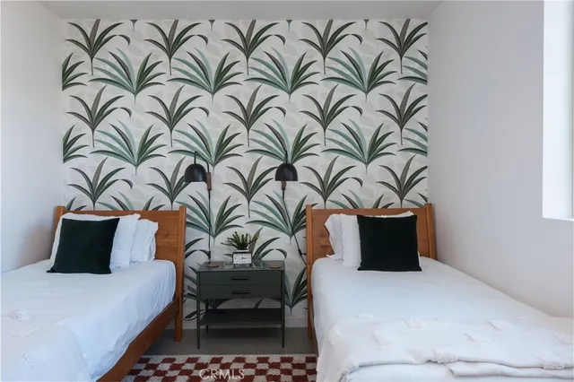 a bedroom with a bed and a lamp