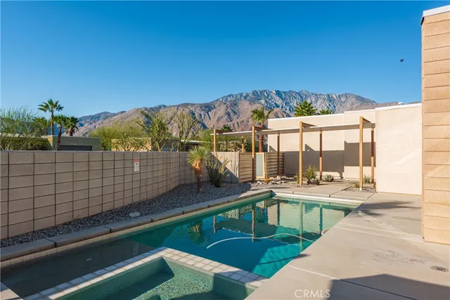a view of a backyard with sitting area