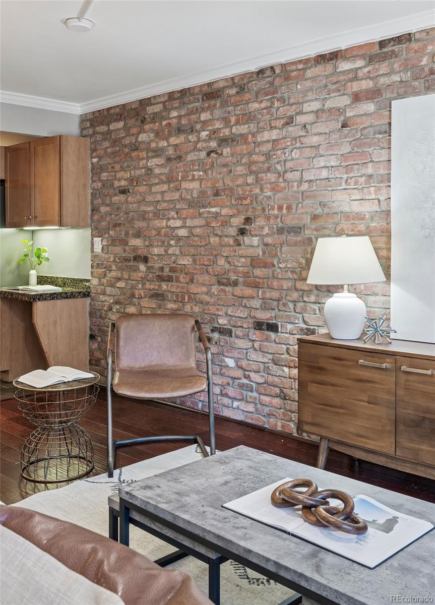 1625 Larimer Street, Unit 1208 Denver, CO 80202 - Photo 18 of 41 a living room with a table and chairs