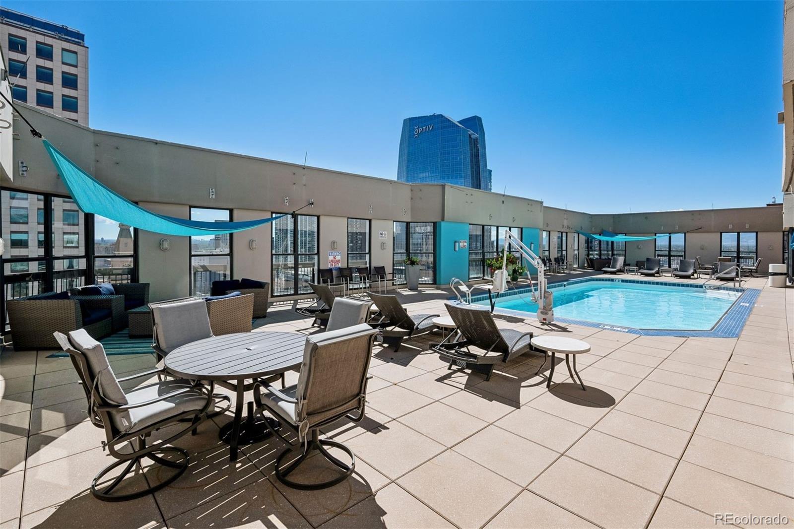 1625 Larimer Street, Unit 1208 Denver, CO 80202 - Photo 20 of 41 a view of a patio with swimming pool table and chairs