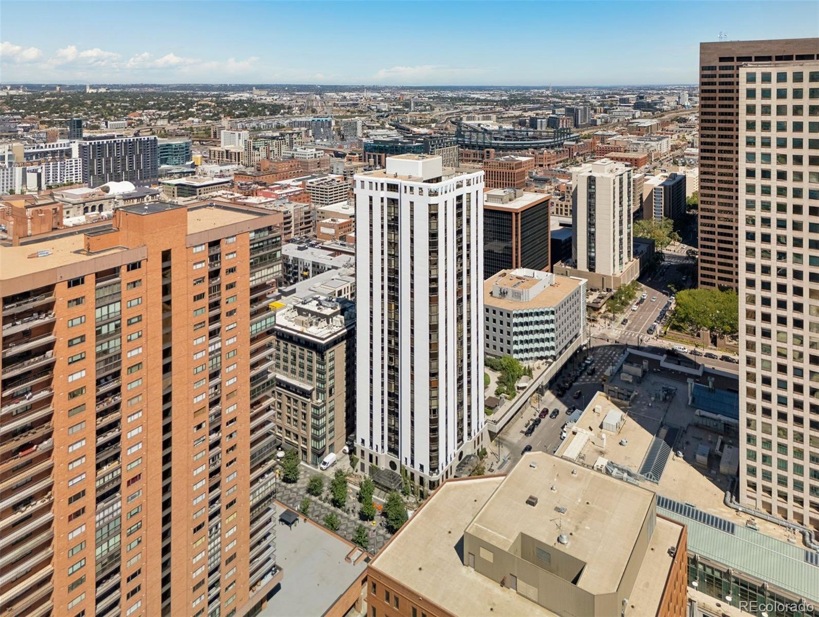 1625 Larimer Street, Unit 1208 Denver, CO 80202 - Photo 35 of 41 a view of a balcony with wooden floor and city view