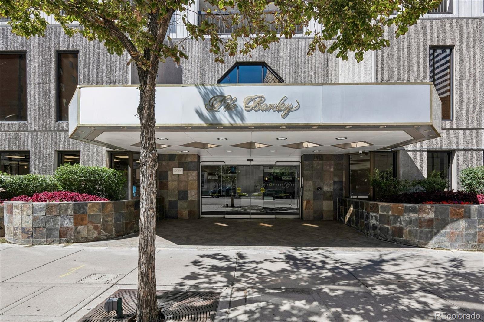 1625 Larimer Street, Unit 1208 Denver, CO 80202 - Photo 37 of 41 a view of a building with a tree