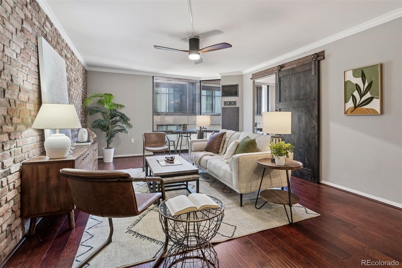 1625 Larimer Street, Unit 1208 Denver, CO 80202 - Photo 8 of 41 a living room with furniture and a table