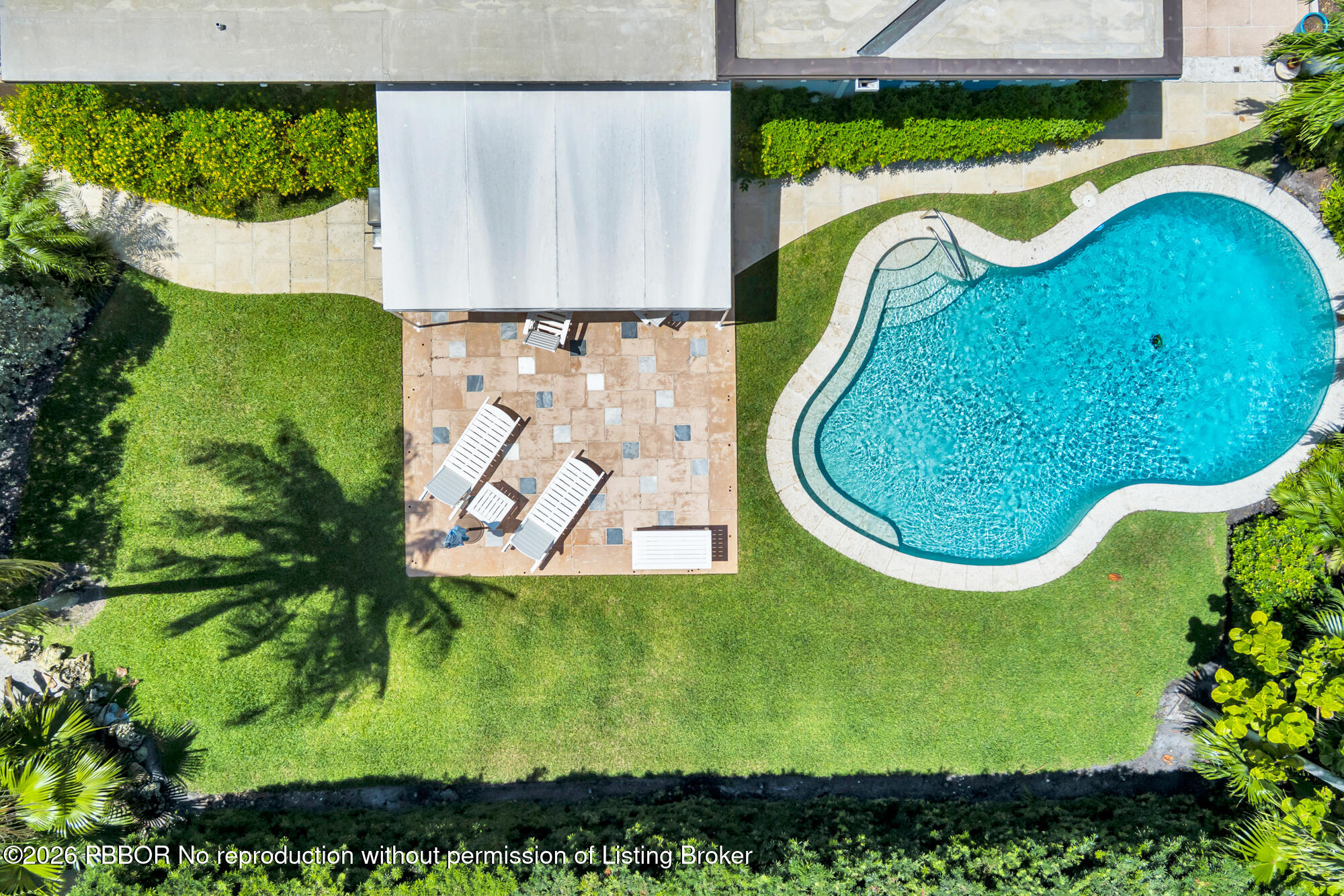 224 Churchill Road West Palm Beach, FL 33405 - Photo 32 of 33 a view of a swimming pool with a garden