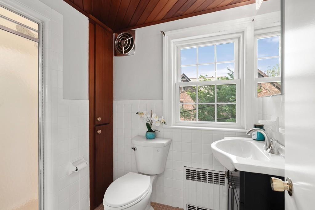 118 Wallis Road Brookline, MA 02467 - Photo 18 of 29 a bathroom with a sink toilet and shower