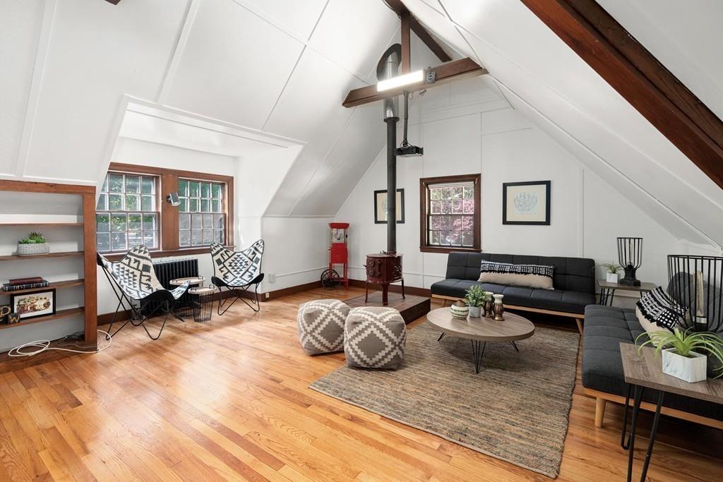 118 Wallis Road Brookline, MA 02467 - Photo 19 of 29 a living room with furniture and a flat screen tv