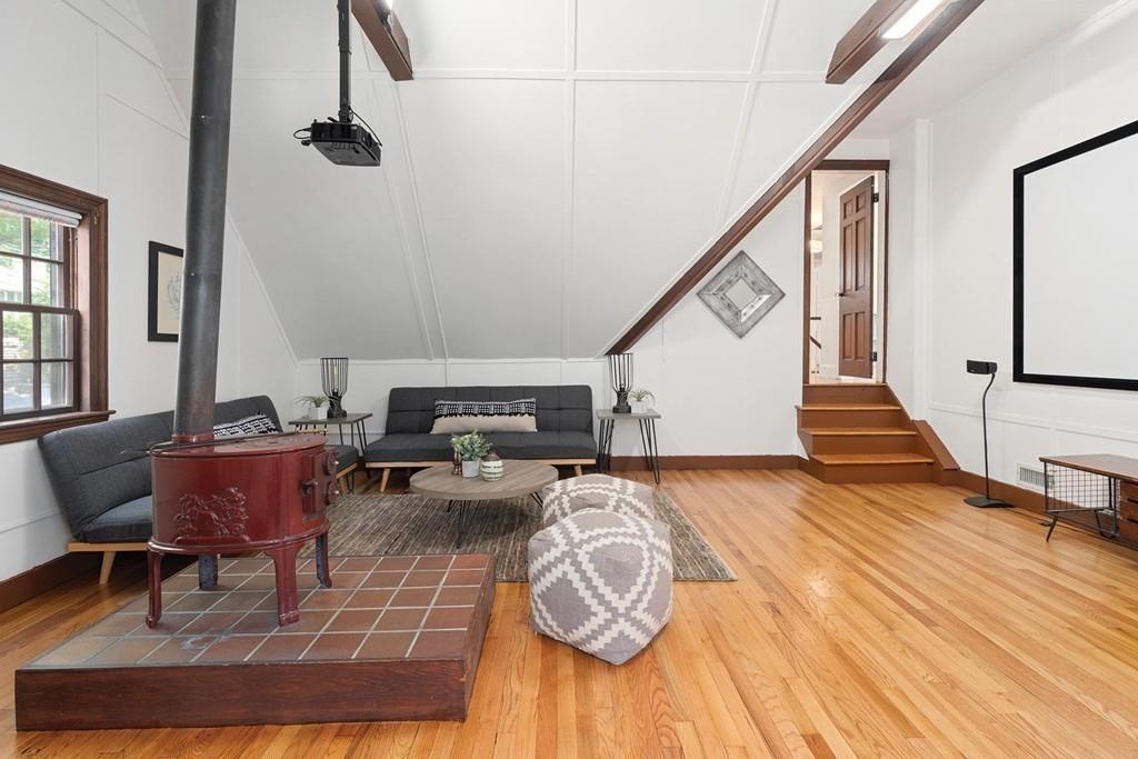118 Wallis Road Brookline, MA 02467 - Photo 20 of 29 a living room with furniture and a wooden floor