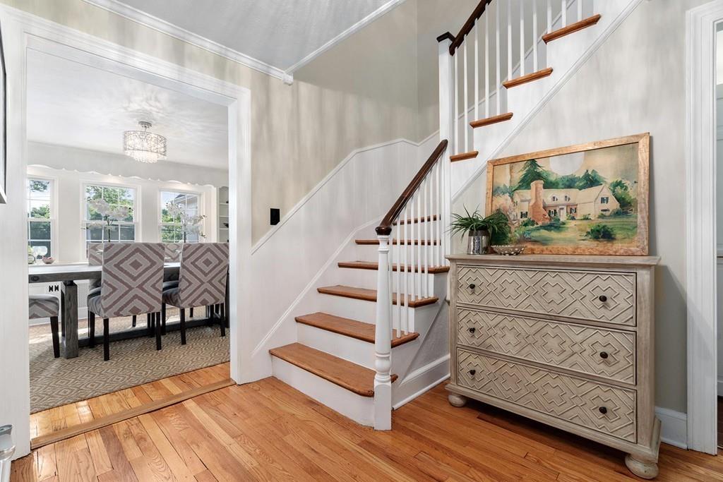 118 Wallis Road Brookline, MA 02467 - Photo 2 of 29 a view of entryway and hall with wooden floor