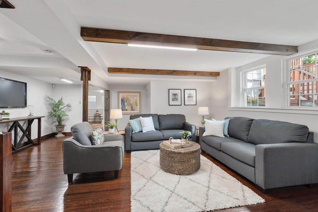 118 Wallis Road Brookline, MA 02467 - Photo 22 of 29 a living room with furniture and a large window