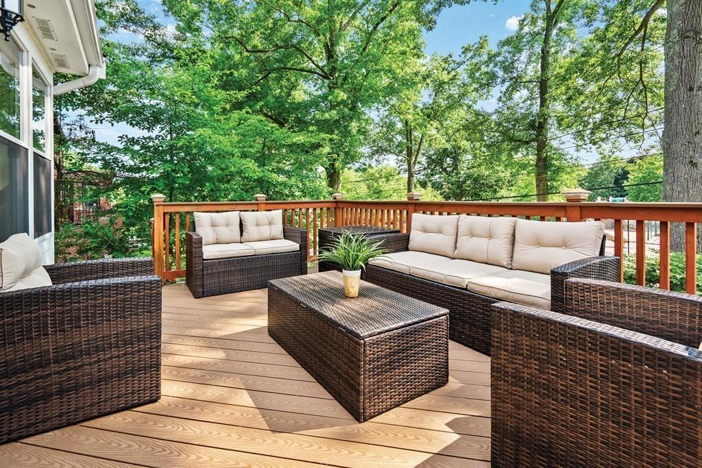 118 Wallis Road Brookline, MA 02467 - Photo 24 of 29 a balcony with wooden floor and furniture