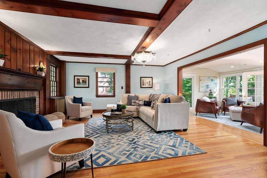 118 Wallis Road Brookline, MA 02467 - Photo 4 of 29 a living room with furniture and a fireplace