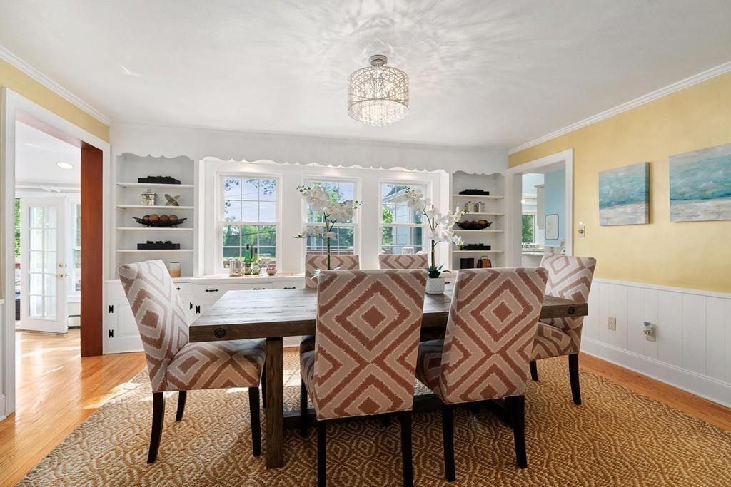 118 Wallis Road Brookline, MA 02467 - Photo 6 of 29 a view of a dining room with furniture window and wooden floor