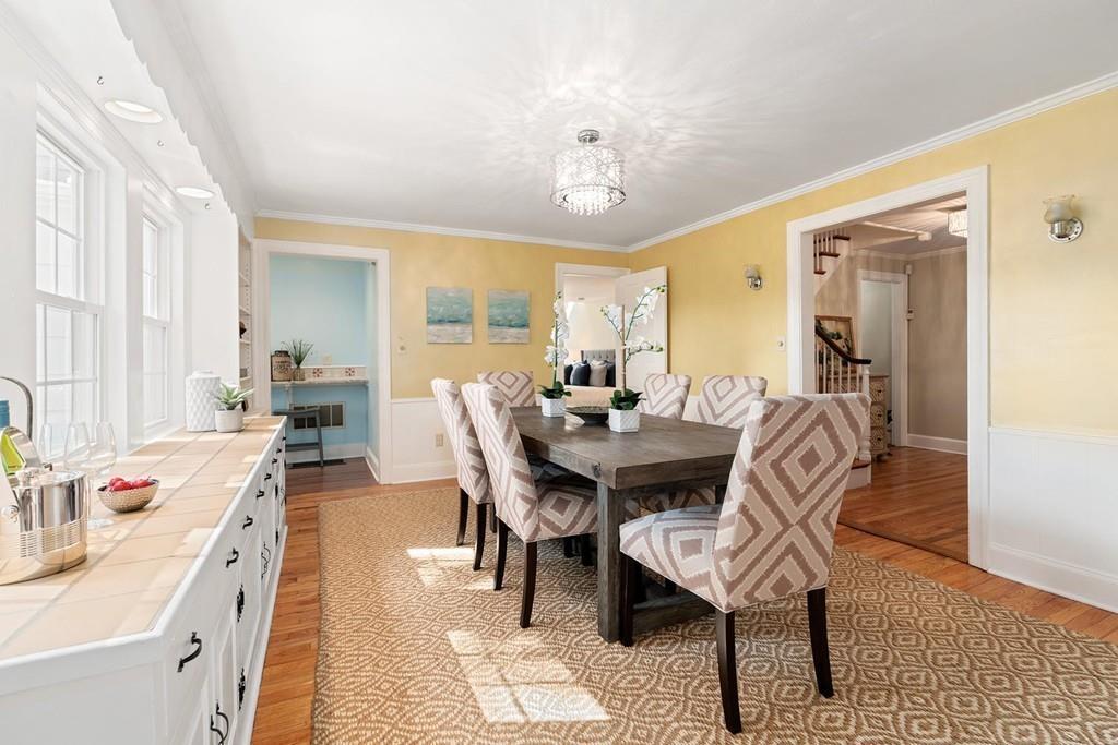 118 Wallis Road Brookline, MA 02467 - Photo 7 of 29 a view of a a dining room with furniture window and wooden floor