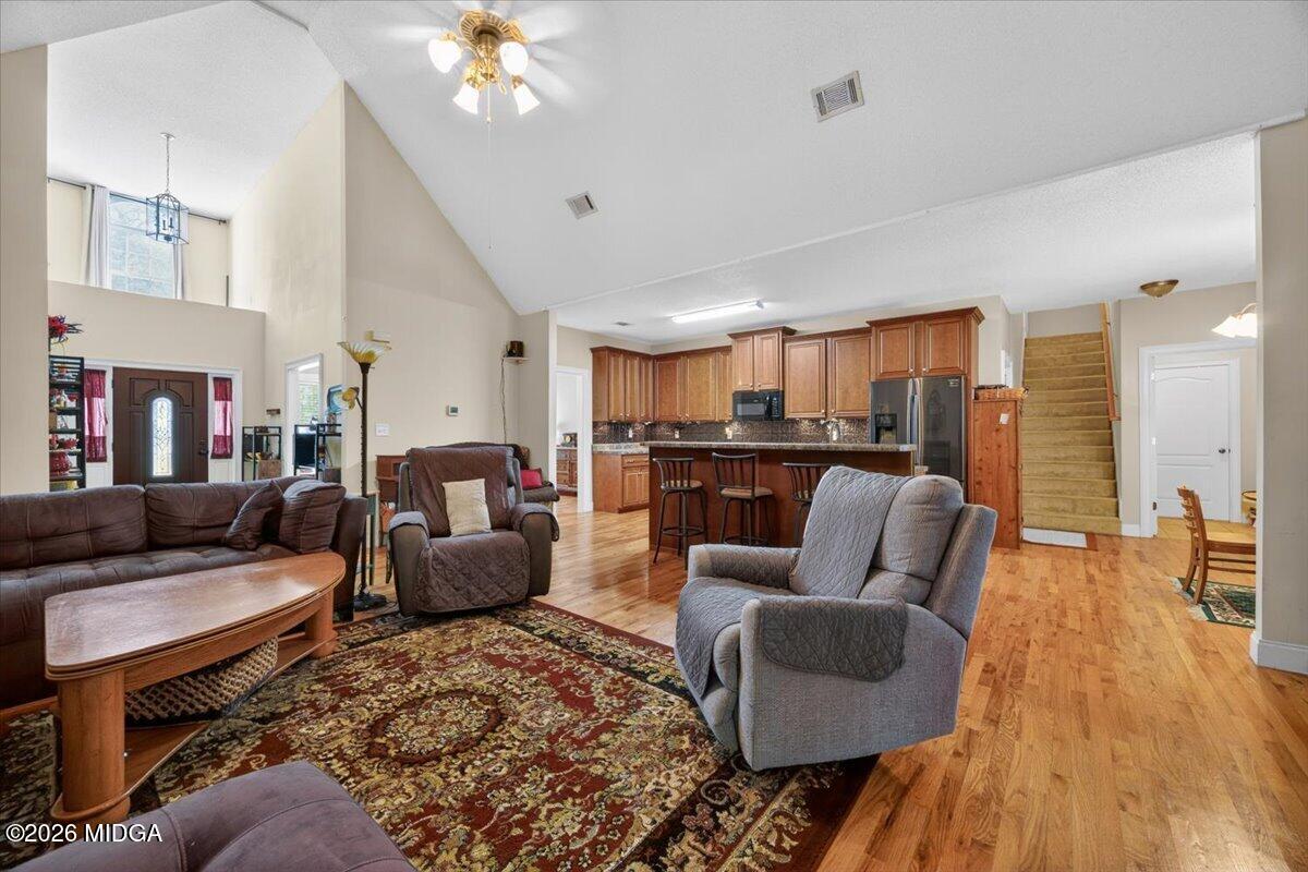 619 Grayridge Road Gray, GA 31032 - Photo 6 of 40 a living room with furniture and wooden floor